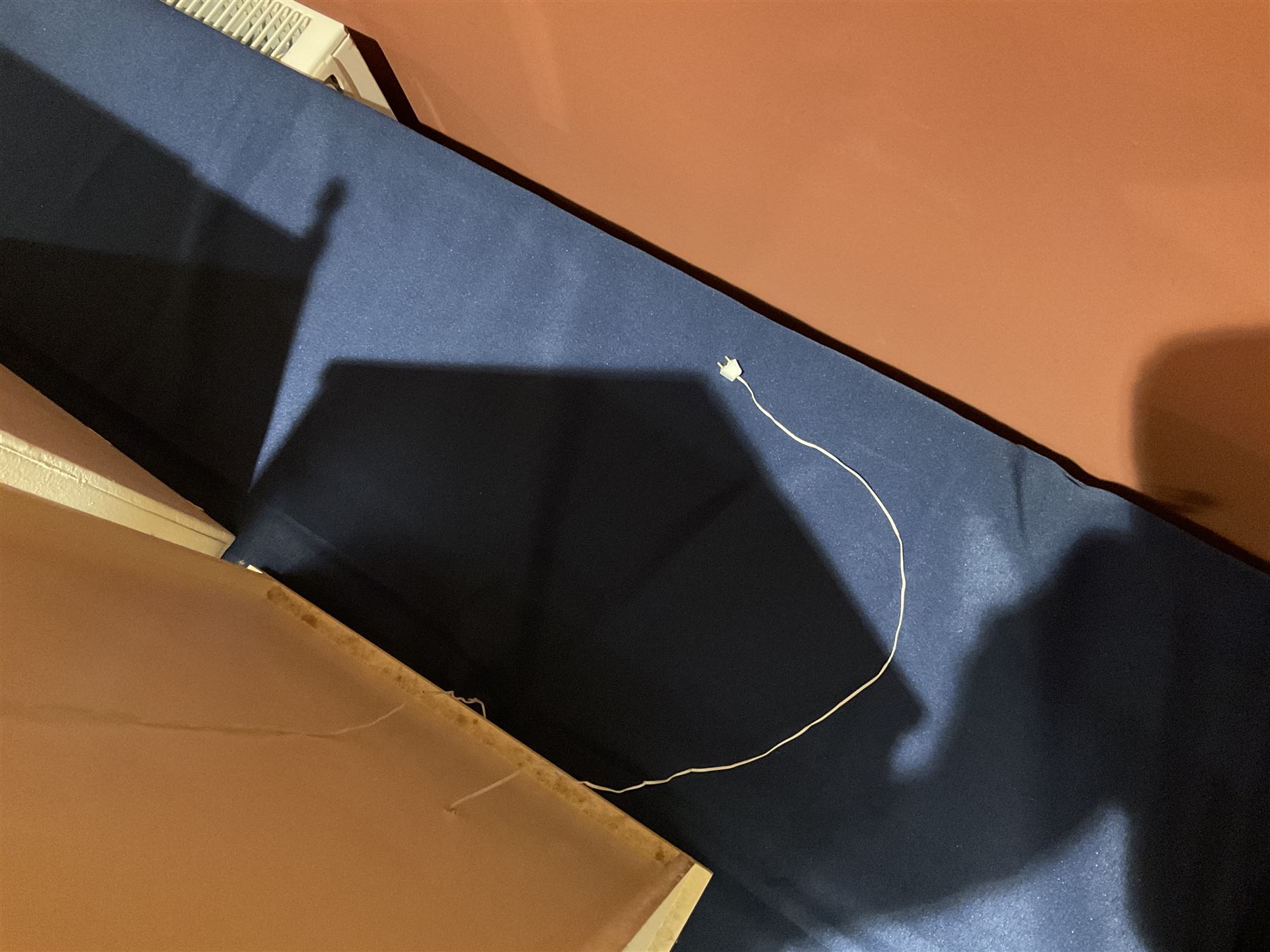 Seagull Pub - scratch-built wooden doll's house as a two-storey gable fronted public house painted in white green and maroon; the hinged front with ground floor veranda and window over opening to reveal two fully furnished rooms with dog-leg staircase and well stocked bar with bar-tender L31cm H62cm D37cm; together with Corner Shop and Dollies Pantry; a similarly painted scratch-built wooden two-storey flat-roofed doll's house as a well stocked ground floor grocery shop with stairs up to two further fully furnished rooms and more stairs giving access to a roof terrace L46cm H57cm D33cm (2)