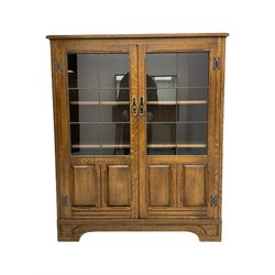 Medium oak display cabinet, fitted with two lead glazed doors