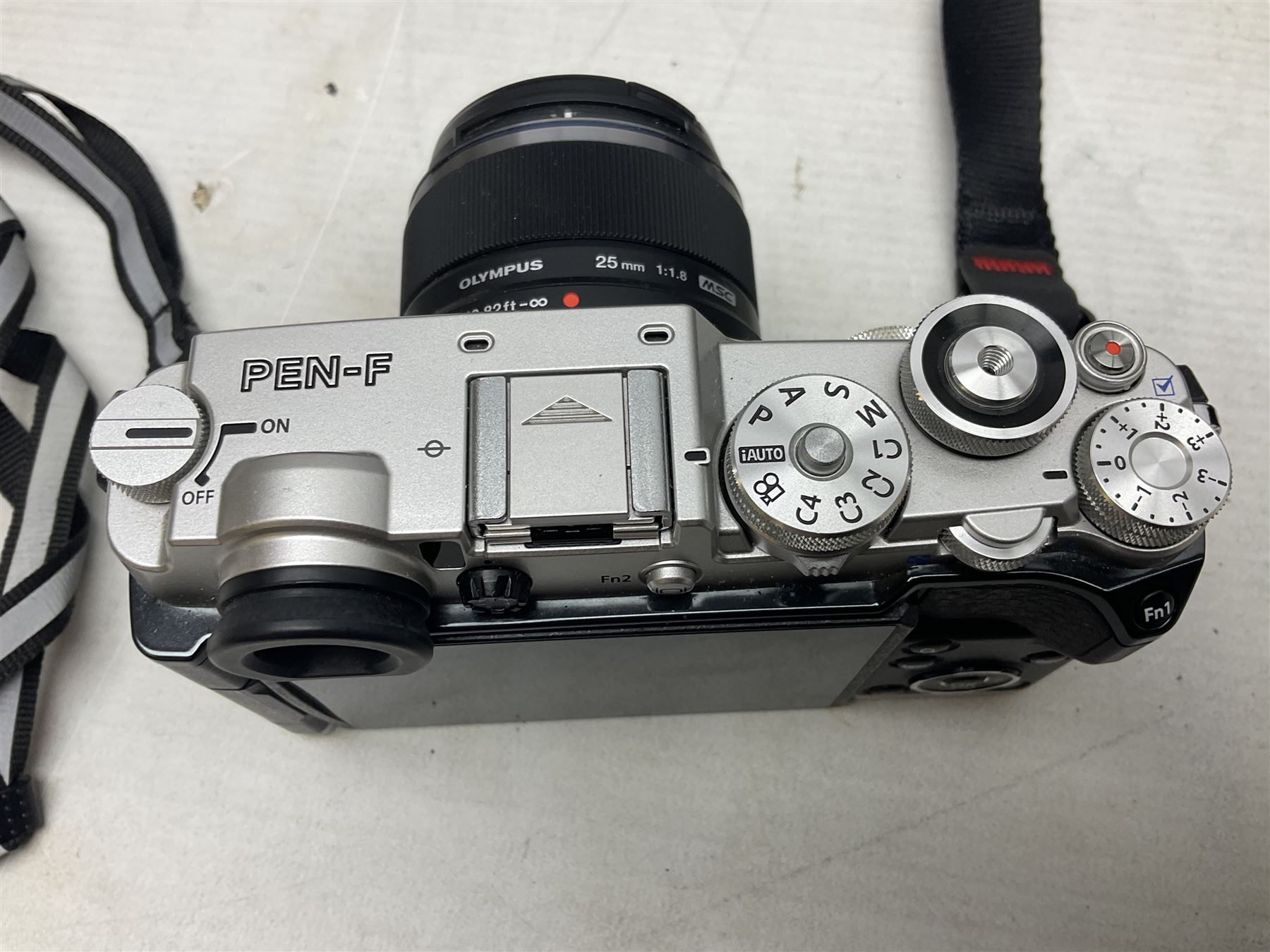 Olympus PEN-F camera body, with 'Olympus M- Zuiko Digital 25mm 1: 1.8' lens,  'Olympus M- Zuiko Digital 75-300mm 1: 4.8 - 6.7' lens and  'Olympus M- Zuiko Digital 17mm 1: 1.8' lens, with original box, together with Lowepro camera bag