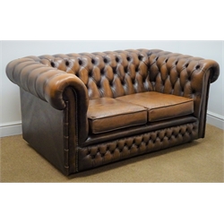  Chesterfield two seat sofa upholstered in deep buttoned brown leather, W150cm  