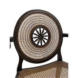 Mid-to late 20th century walnut Hepplewhite design elbow chair, circular cane back with pierced and carved central rosette, fluted frame with scrolling arms, cane seat raised on fluted rail and square tapering supports with spade feet