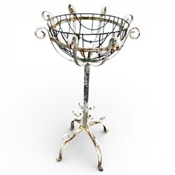 Two plant stands in a weathered white finish with wire baskets