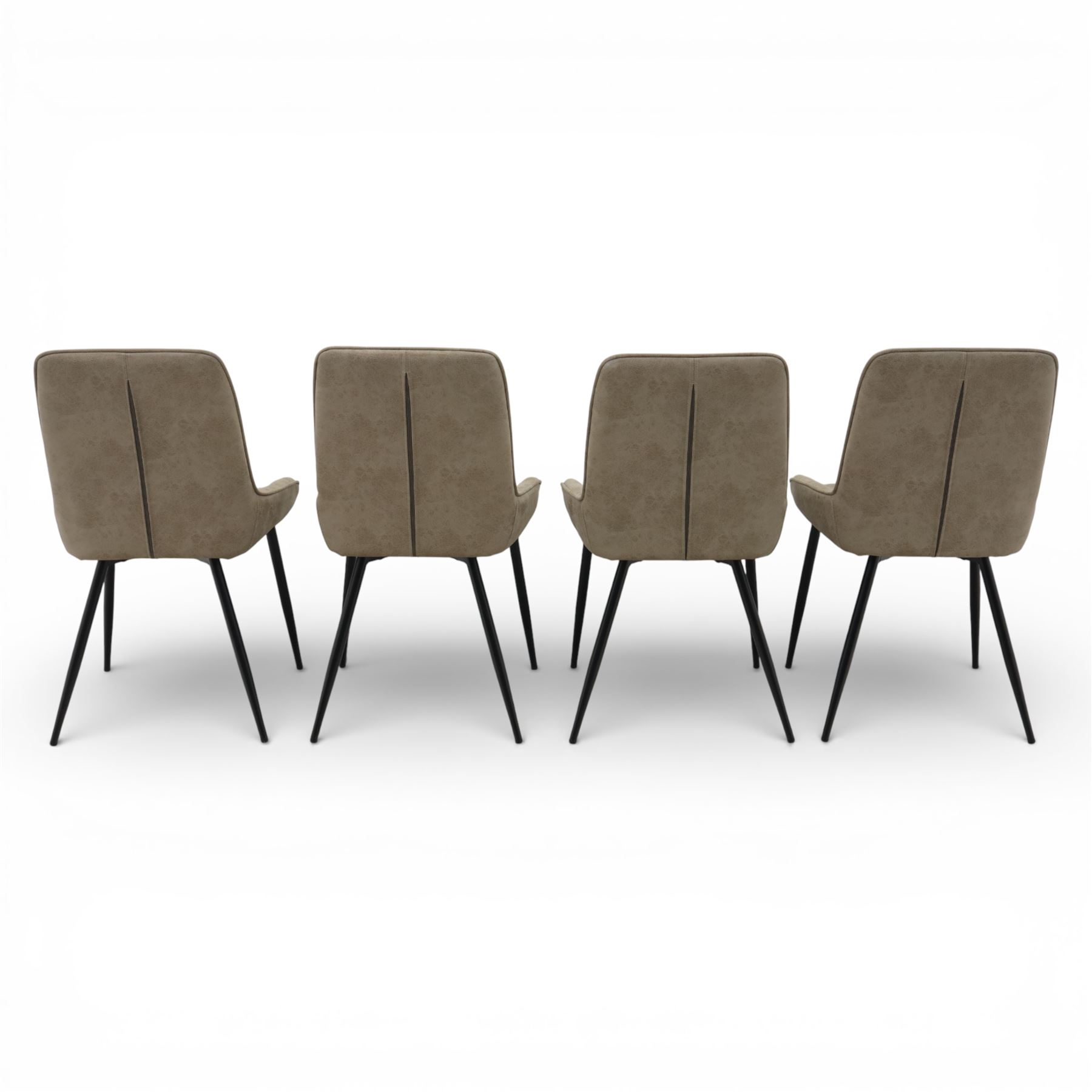 Next Home - ‘Monza’ design set of four dining chairs, upholstered in mink-toned faux leather with diamond quilted backs and plain padded seats, shaped backs with integrated side wings, raised on black painted tapering metal supports
