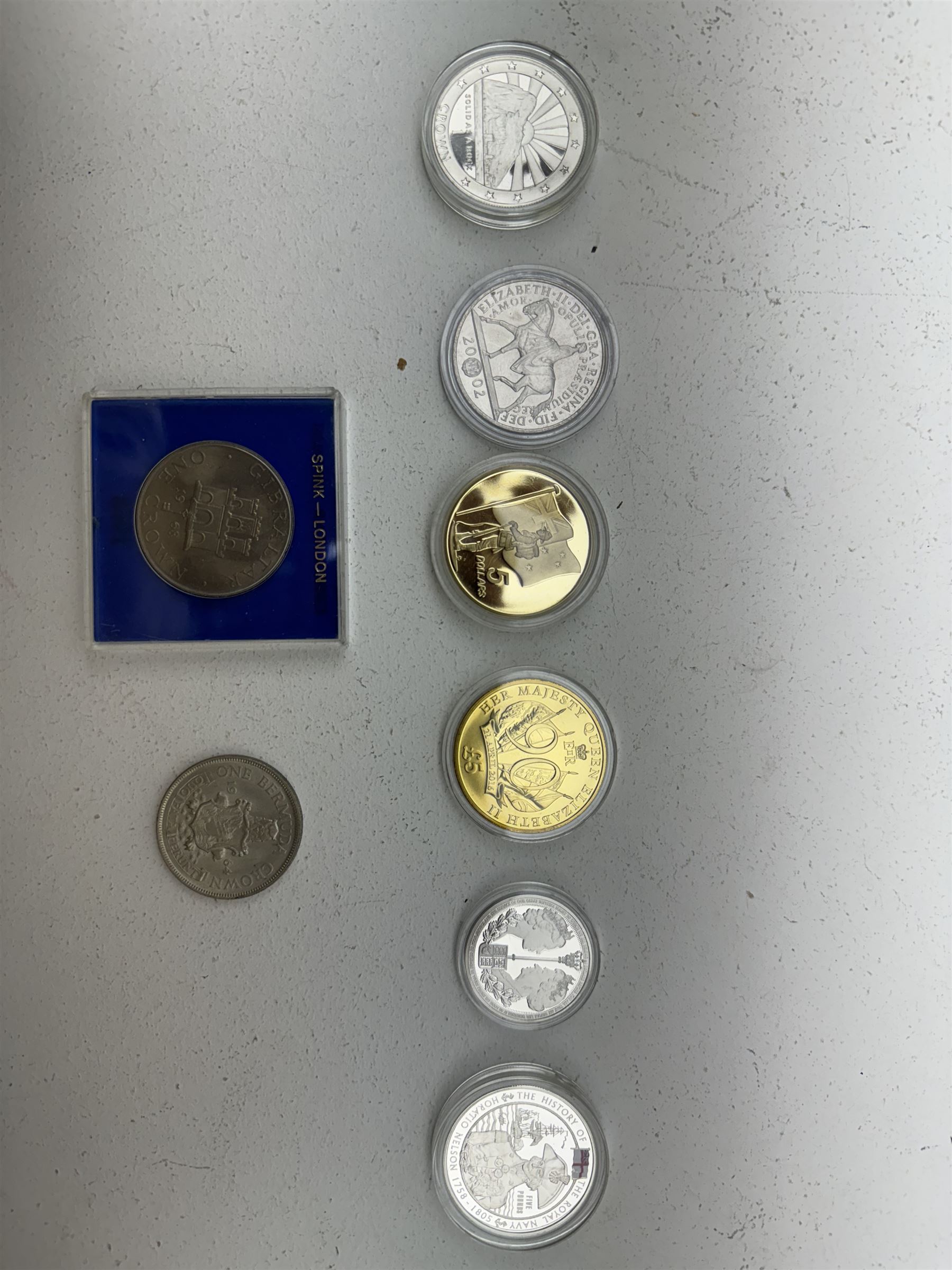 Coins including Queen Elizabeth II Bermuda 1964 crown, Britain's first decimal coins sets in blue wallets, various commemorative crowns, 2018 S and Q uncirculated ten pence coins on cards, five pound coins etc