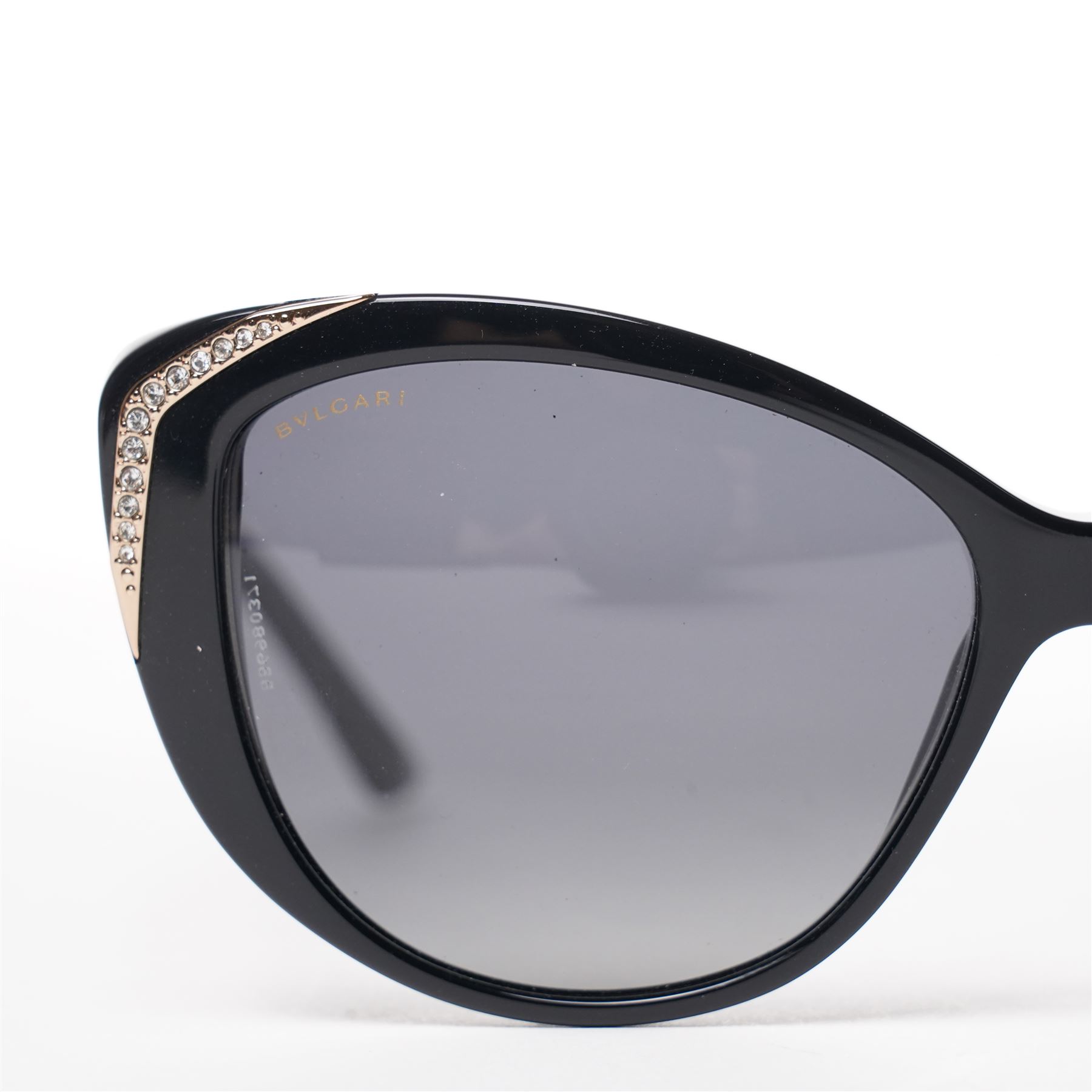 Bulgari - pair of oversized cat-eye sunglasses, with gradient tinted lenses in a black frame, the temples and arms with gold-tone hardware inset with pave-jewelled hinge detail, with original cloth pouch, hard leather case and box