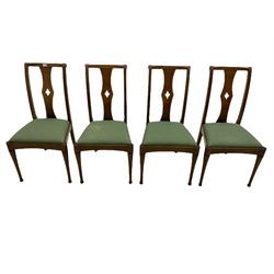 Set of eight contemporary walnut dining chairs, curved backs set with shaped splats with pierced detail, drop in upholstered seat cushions, on turned supports 