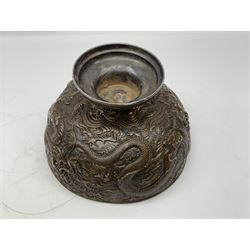 Large Chinese bronzed footed bowl, decorated in relief with dragons chasing the flaming pearl, with character mark beneath, H18.5cm D27.5cm
