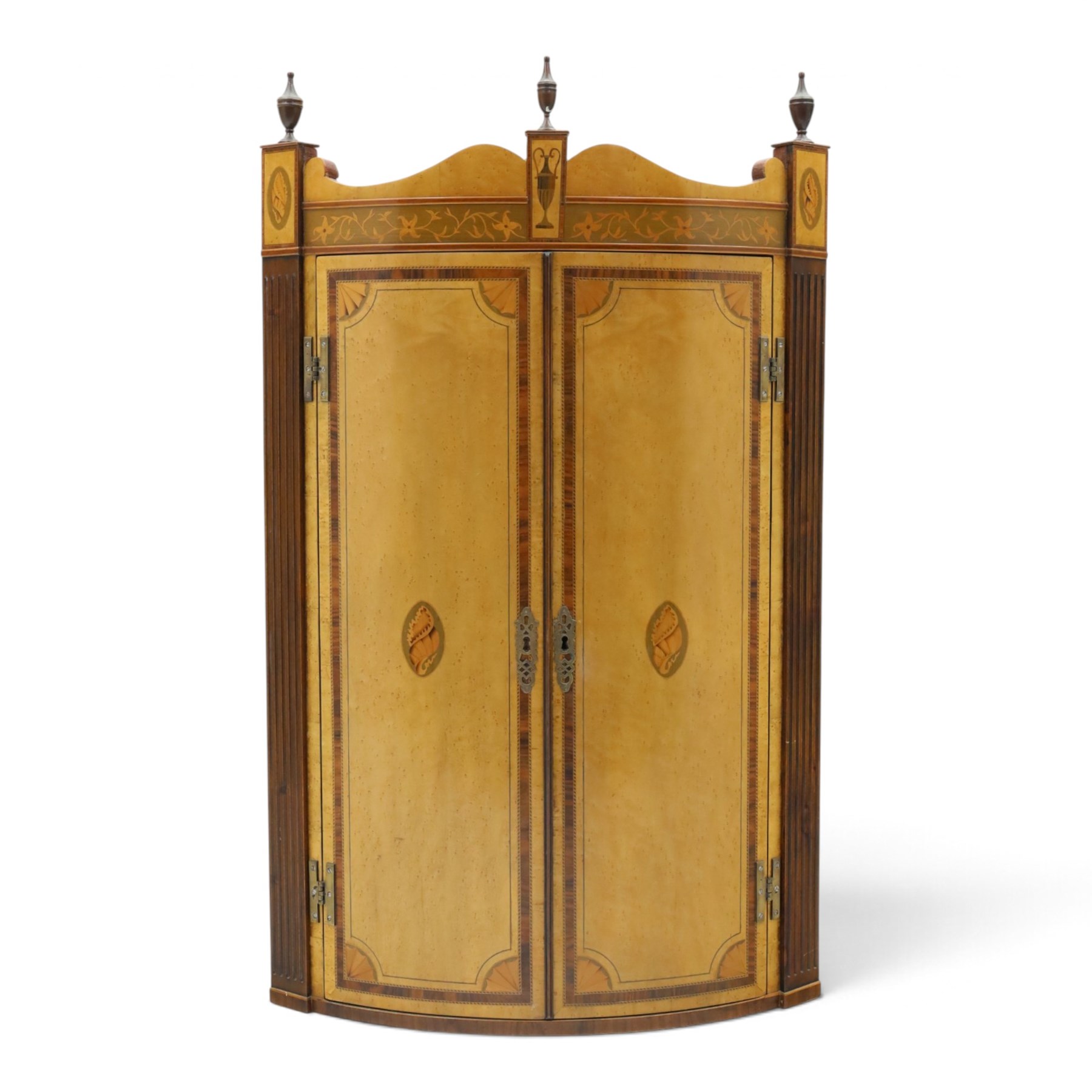 Edwardian inlaid birds-eye maple corner cabinet, urn finials above shell motif inlays, reeded column's hanging hooks