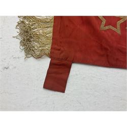 1970s Soviet banner printed in gold on a red ground, roughly translates as 'Transferable Banner - To the winner in the Socialist Competition' and 'Work Study Live by Communism' verso; wreath of wheat ears to either side; tassels on three sides 110 x 155cm