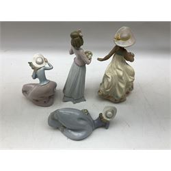 Four Lladro figures, comprising Carefree, gres finish, no 2288, Innocence in Bloom, no 7644, Pretty Pose, no 5589 and Blustery Day, no 5588, all with original boxes, largest example H22cm
