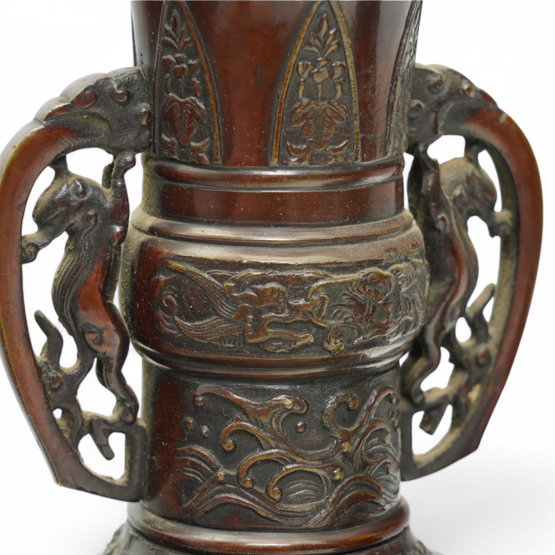 Pair of Japanese two-handled bronze vases, of baluster form with elongated neck, decorated with a raised pattern of birds and flowers, H26cm (2)