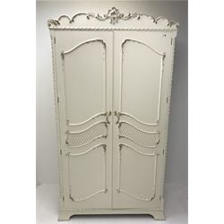 Late 20th century French style white and gilt double wardrobe,  shell carved cresting rail, two doors enclosing fitted interior, shaped bracket supports