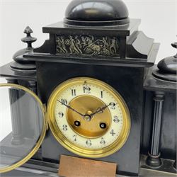 French eight-day mantle clock in a Belgium slate case, with an early 20thth century French Parisian rack striking movement, recoil escapement striking the hours and half-hours on a coiled gong, enamel chapter ring with a recessed gilt centre, upright Arabic numerals with minute markers and steel fleur de Lis hands, cast brass bezel with bevelled glass, case on a rectangular stepped plinth with  four recessed fluted columns, tympanum containing a scene from Greek mythology, with three oblate domes and matching finials, presentation plaque dated 1909.
With pendulum and key.
