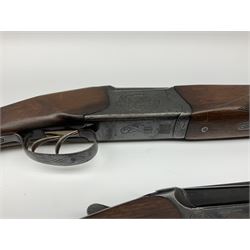 Two Russian Baikal 12-bore over-and-under double barrel boxlock non-ejector sporting guns; one with 68.5cm barrels, walnut stock with chequered pistol grip and fore-end and thumb safety, serial no.520545, L111cm overall; the other with 72.5cm barrels, walnut stock with chequered pistol grip and fore-end and thumb safety, serial no.012448, L114.5cm overall (2) SHOTGUN CERTIFICATE REQUIRED