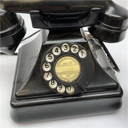  A Vintage black Bakelite telephone, together with another vintage metal bodied example with Bakelite receiver, marked Bell.   