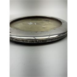 A silver mounted photograph frame of circular form, hallmarked Boots Pure Drug Company, Birmingham 1909, D11.5cm, together with a white metal model of a ship on base, and a mahogany box containing a quantity of old keys. 