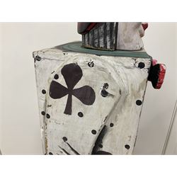 Folk art circus clown cabinet, the the two hinged doors with bow tie decoration opening to reveal fitted shelved interior, the body painted with polka dots and spades, H121cm