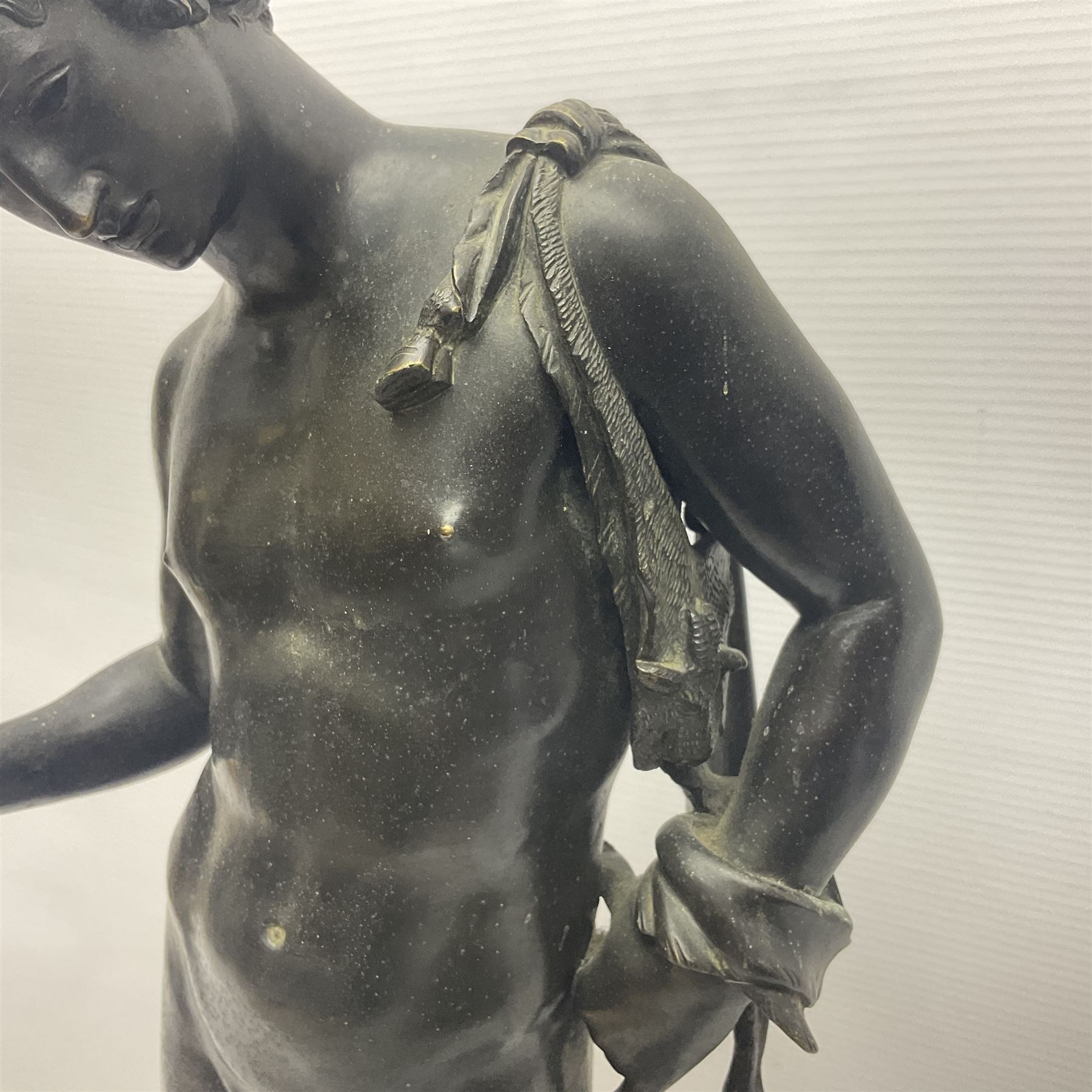 Bronzed classical nude male figure, upon a stepped circular base, H61cm 