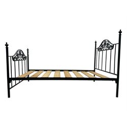 Contemporary metal double bed frame, shaped head and footboards with foliate cast panels and vertical rod supports, the corner posts with urn-shaped finials, finished in a mottled verdigris-style green, with pine slatted base