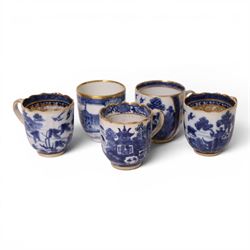 Five 18th century Qing Dynasty export coffee cups, all similar decoration in blue and white with gilt detail, together with two tea bowls  