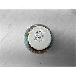 Limited edition Moorcroft enamel vase, decorated in the Lundy Island pattern, with certificate signed by the artists, no 58/75, in fitted box