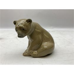 Two Lladro figures of bears, brown bear standing, no 1204, and brown bear seated, tallest example H10cm