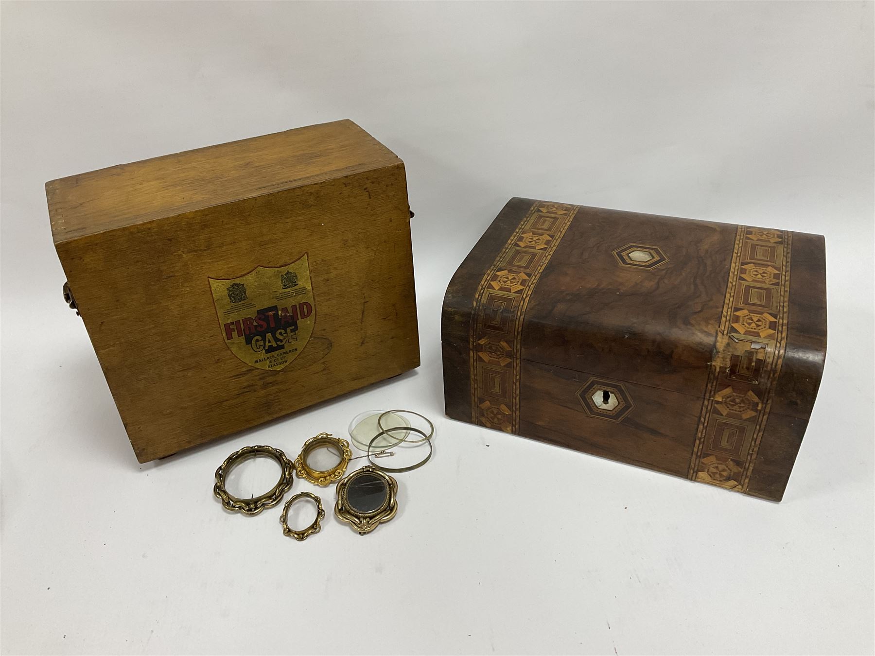 Victorian walnut box with Tunbridge ware banding and mother-of-pearl inlay, W29.5cm H14cm, together with first aid kit box and Group of early 20th century ornate gold plated (tested) and gilt brooch frames and panel fronts