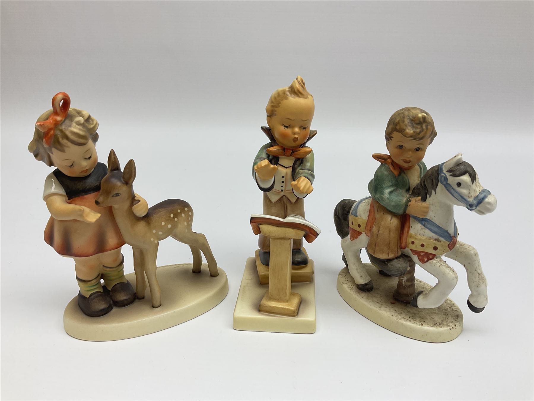 Twenty six Hummel figures by Goebel, to include Fire Fighter, Band Leader and Spring Sowing