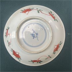 Three Chinese famille verte examples, approximately Yongzheng period, to include two teabowls and two saucers, each decorated with flowers and butterflies, two with sacred fungus mark within double rings, the teabowl with lotus mark, the other indistinct - possibly a Wan mark within lozenge (4)