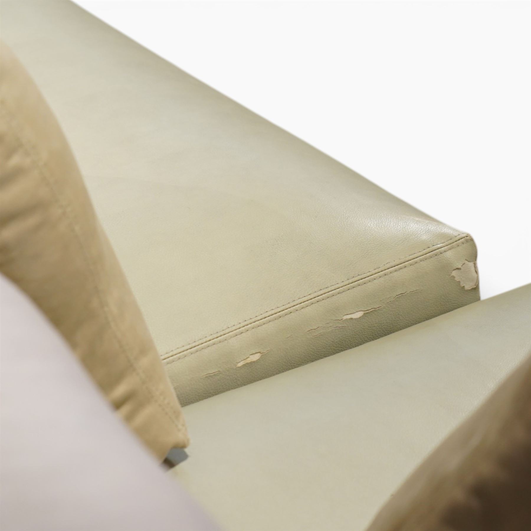 Christian Liaigre (1943-2020) - 'Arpege' handmade L-shaped sectional sofa, upholstered in neutral leather, with broad squared arms, deep seat cushions, angled chaise section, loose back cushions, raised on block feet