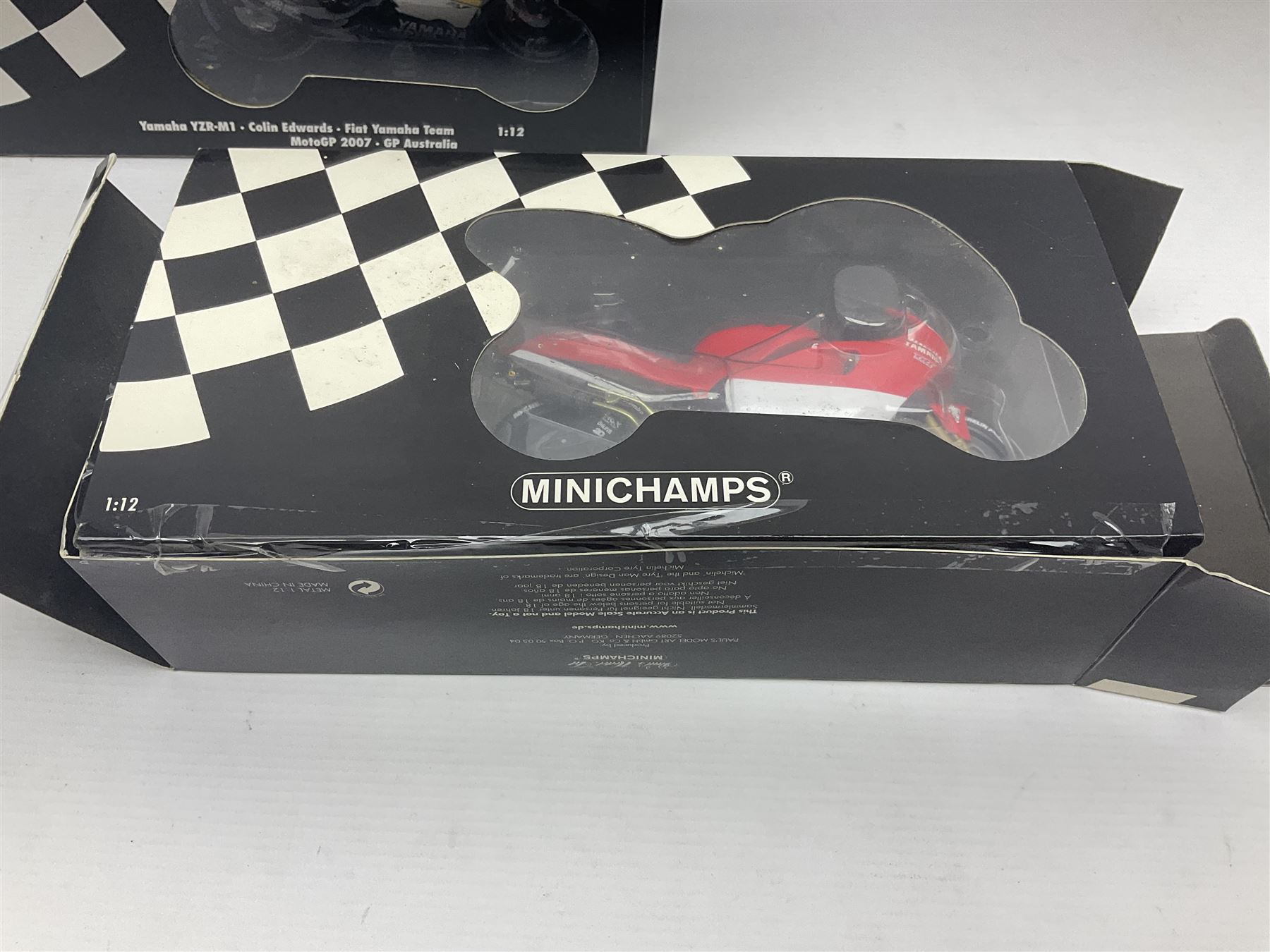 Three Minichamps 1:12 scale die-cast motorcycles - Yamaha YZR 500 Max Biaggi 2000; Yamaha YZR-M1 Colin Edwards Fiat Yamaha Team MotoGP 2007 GP Australia; and Yamaha YZR 500Team Yamaha Max Biaggi 500ccGP 2001; all boxed (3)