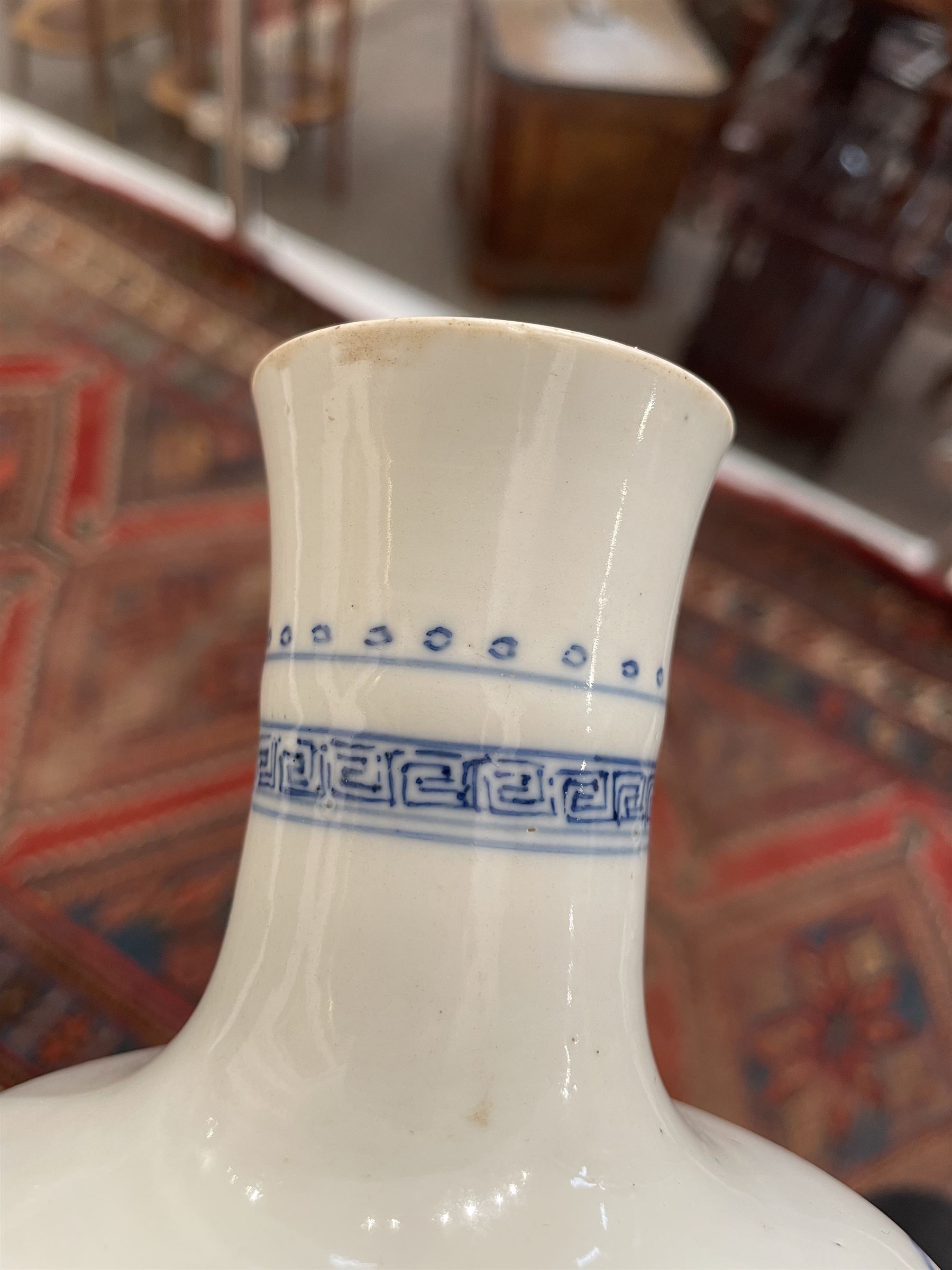Chinese Kangxi porcelain vase, of baluster form painted in underglaze blue with seated figures and attendants, with fence, rockwork and leafy bamboo branches, with concentric circles mark beneath, H22.5cm