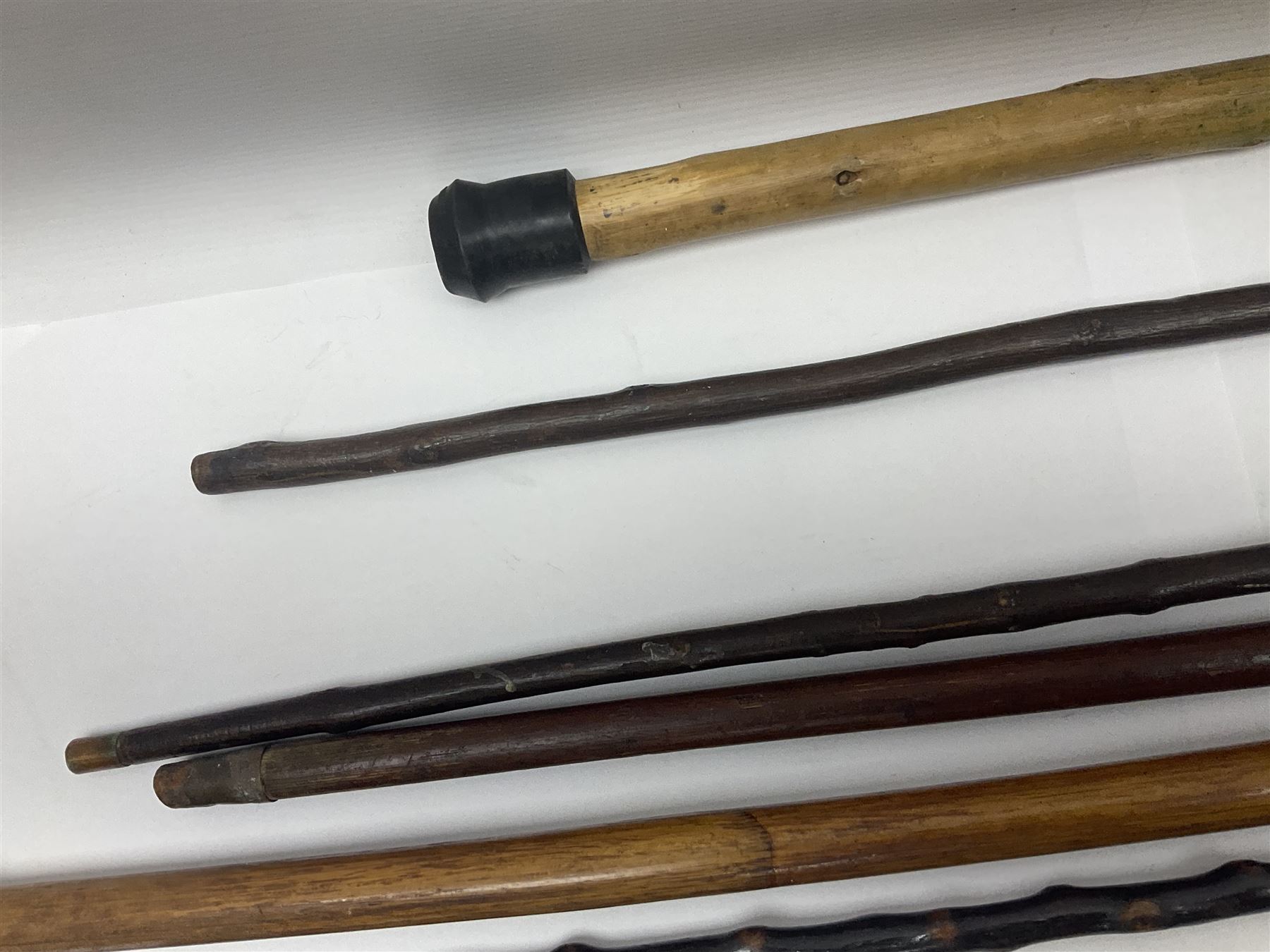 Collection of walking sticks including silver collared example and horn handles, largest L92cm 
