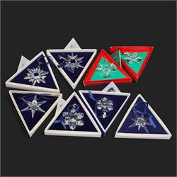Eight Swarovski crystal snowflake Christmas ornaments, comprising years 1991-1998, some with certificates, boxed (8)