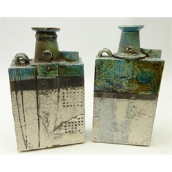  Peter Hough (British Contemporary) two slab form raku fired vases, turquoise, cream & charcoal matte sectioned ground with loop handle, impressed H mark to neck, H27cm & H27.5cm (2)  