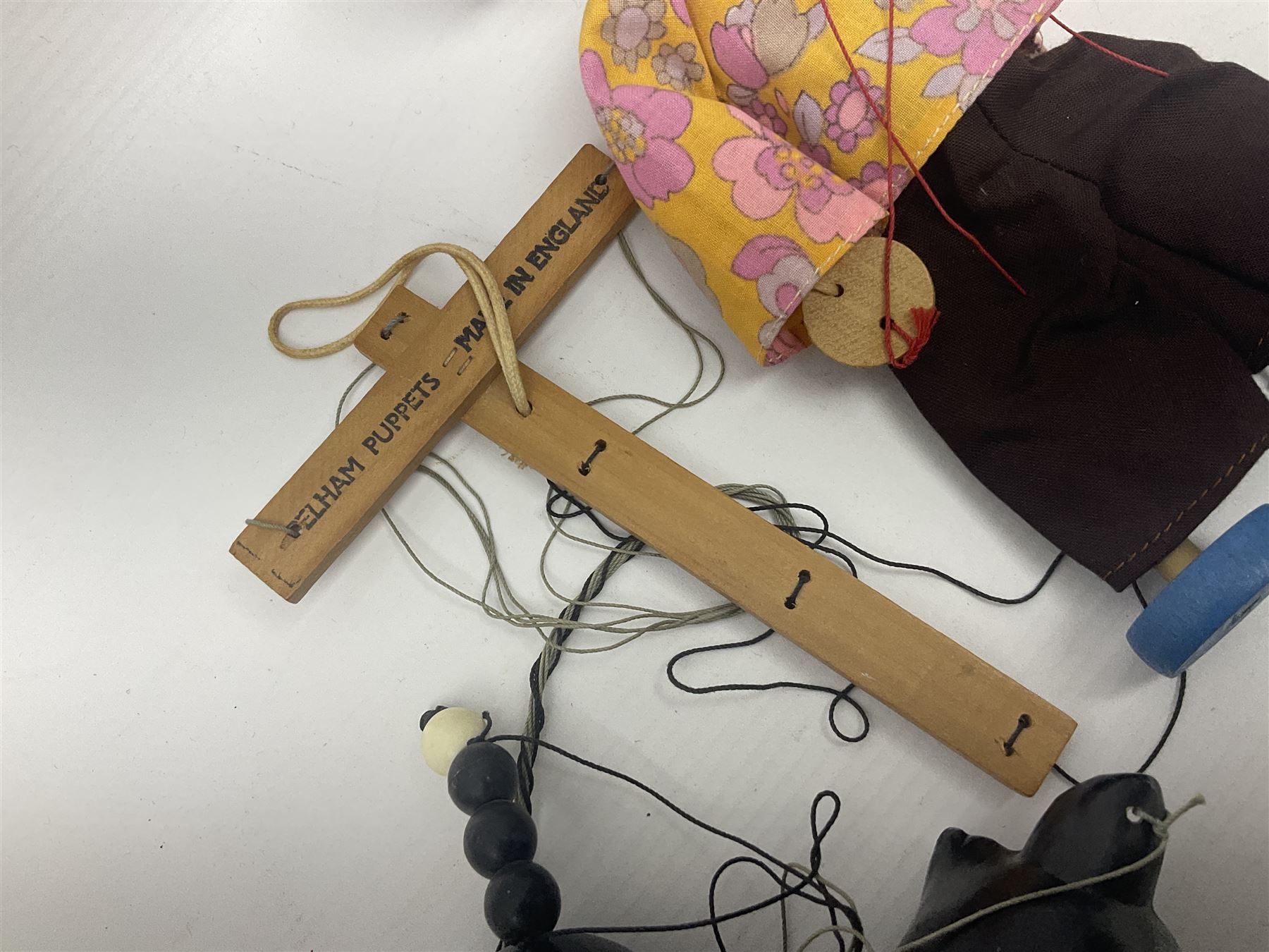 Pelham Puppet - three puppets comprising a painted wooden duck with felt mouth and wings with metal joints H12cm, in original box and instructions; and two further examples Type A cat with a hollow body H12cm, and a boy H23cm (3) 