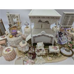 Dolls house bedroom and dressing room furniture, including beds, wardrobe, dressing table, lamps, tables, two figures and a collection of accessories