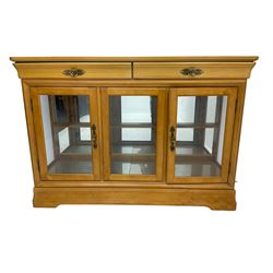Yew wood sideboard, rectangular top with mahogany and ebony stringing, fitted with two drawers over three glazed cupboard doors enclosing glass shelves