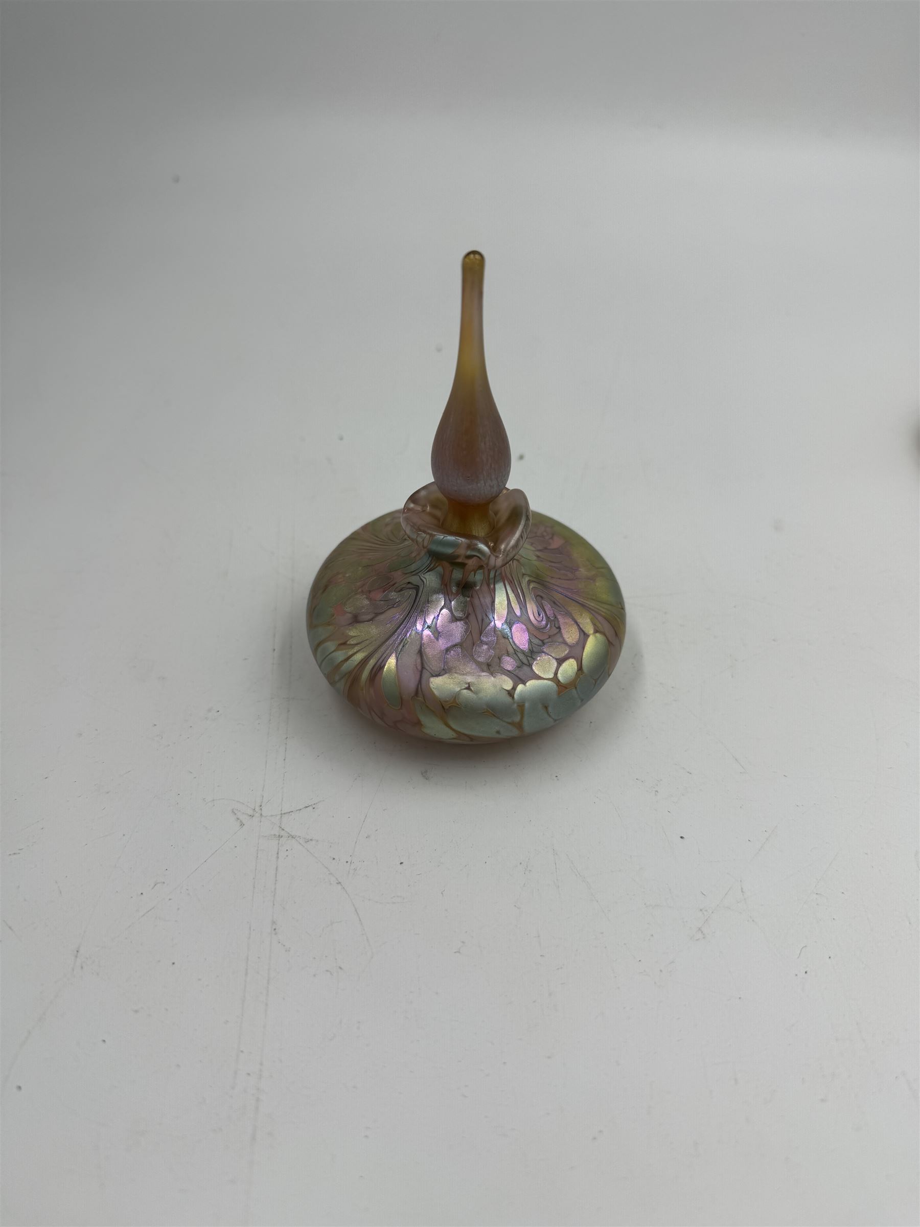 Three Okra scent bottles, each decorated with iridescent patterns on a pink ground, including perfume apple, all with original boxes, from Richard P Golding Studio 