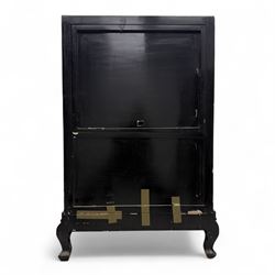 Late 20th century Chinoiserie black lacquer cabinet, the rectangular body decorated with hand-painted floral and foliate motifs in polychrome and gilt, fitted with four panel doors enclosing shelved interior, on shaped apron and stylised cabriole supports with gilt scrollwork