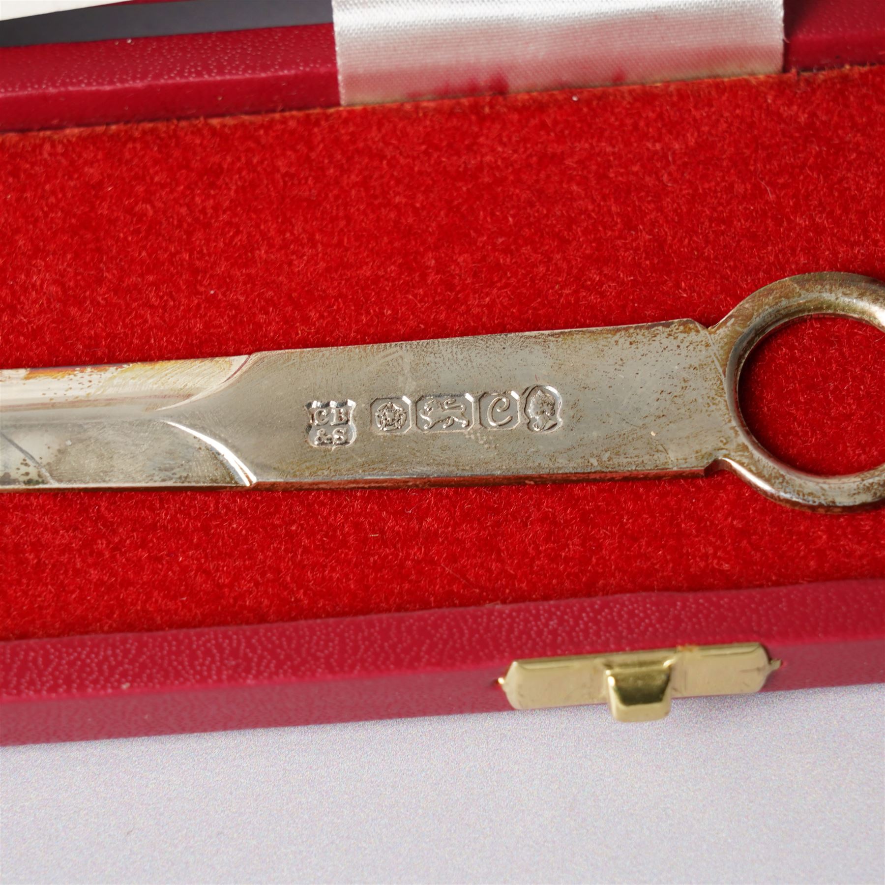 Pair of Edwardian silver candlesticks H16cm Chester 1908 Maker S Blanckensee & Son Ltd and a silver meat skewer/ paper knife, cased Sheffield 1977 Maker Cooper Bros