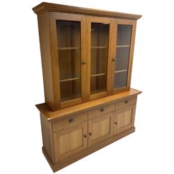 Large cherry wood dresser, raised display cabinets enclosed by three doors, fitted with three drawers and three panelled cupboards, on skirted base