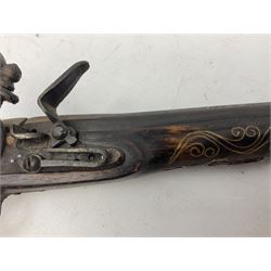 Reproduction flintlock pistol, the full walnut stock with brass filigree inlay and mounts and skull crusher butt L46cm; no visible proof marks FIREARMS CERTIFICATE REQUIRED OR RFD