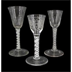 Three 18th century drinking glasses, two examples with funnel part moulded bowls, the other example with ogee floral engraved bowl, each upon double series opaque twist stems and conical feet, tallest H16.5cm 