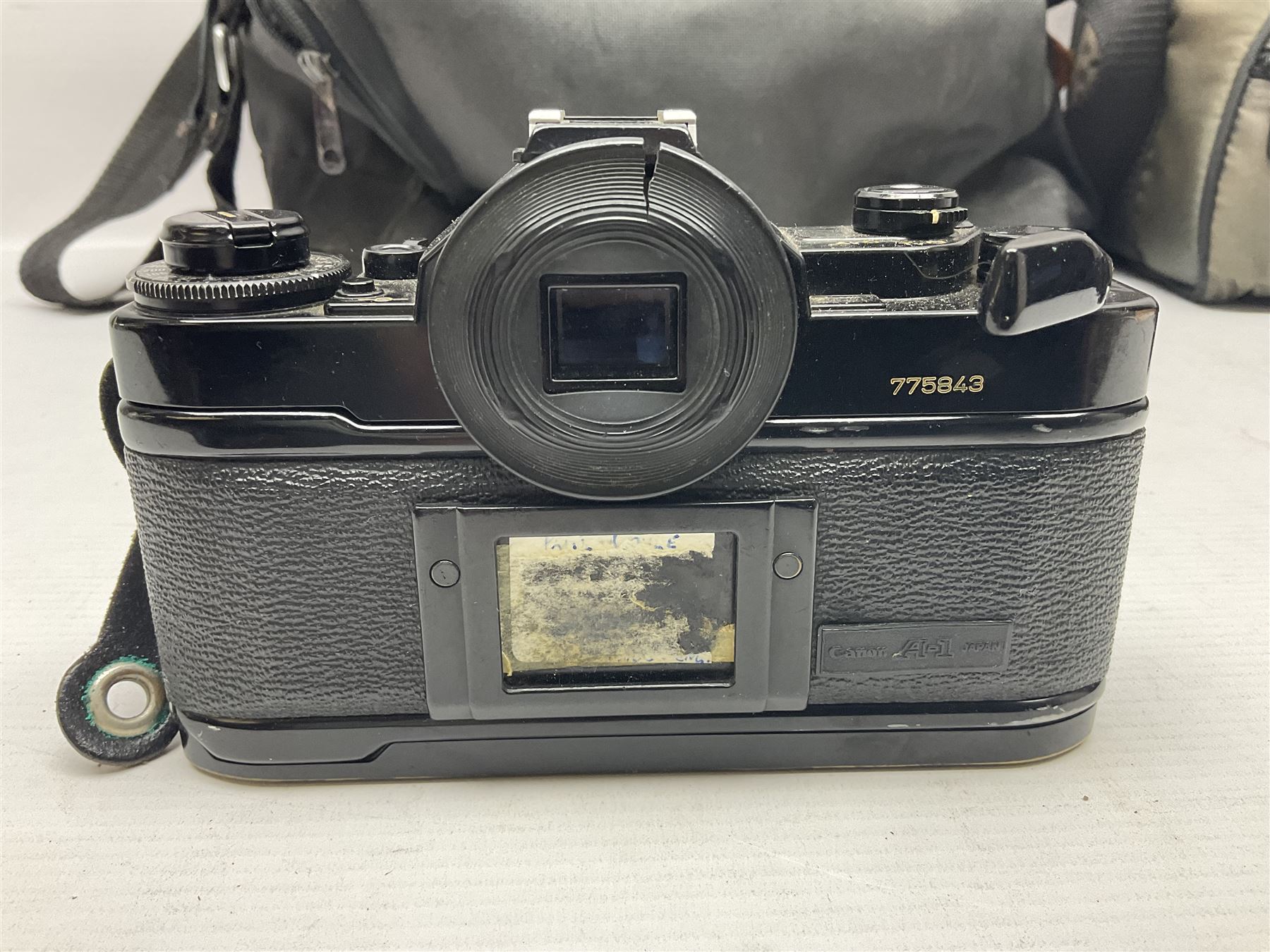 Canon A1 camera body, serial no 775843, together with 'Canon Lens FD 200mm 1:4 lens' serial no 24432, together with Semi Minolta folding camera, Canon 'Zoom FD 35-105mm 1:3.5-4.5' lens, Canon 'Macro Focusing Zoom 72mm Hanimex HMC 28-200mm' lens and other camera equipment  