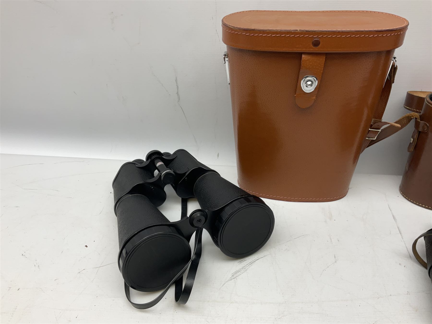 Eleven pairs of binoculars, to include Zeiss Wetzler 20x50, Taylor-Hobson Bino Prism No.2 Mk.III military stamped 1943 with broad arrow,  Swift Tecnar 16x50, J.T Coppock Oceanic Bloomed 10x50, Hensoldt Wetzlar Dialyt 7x42 etc