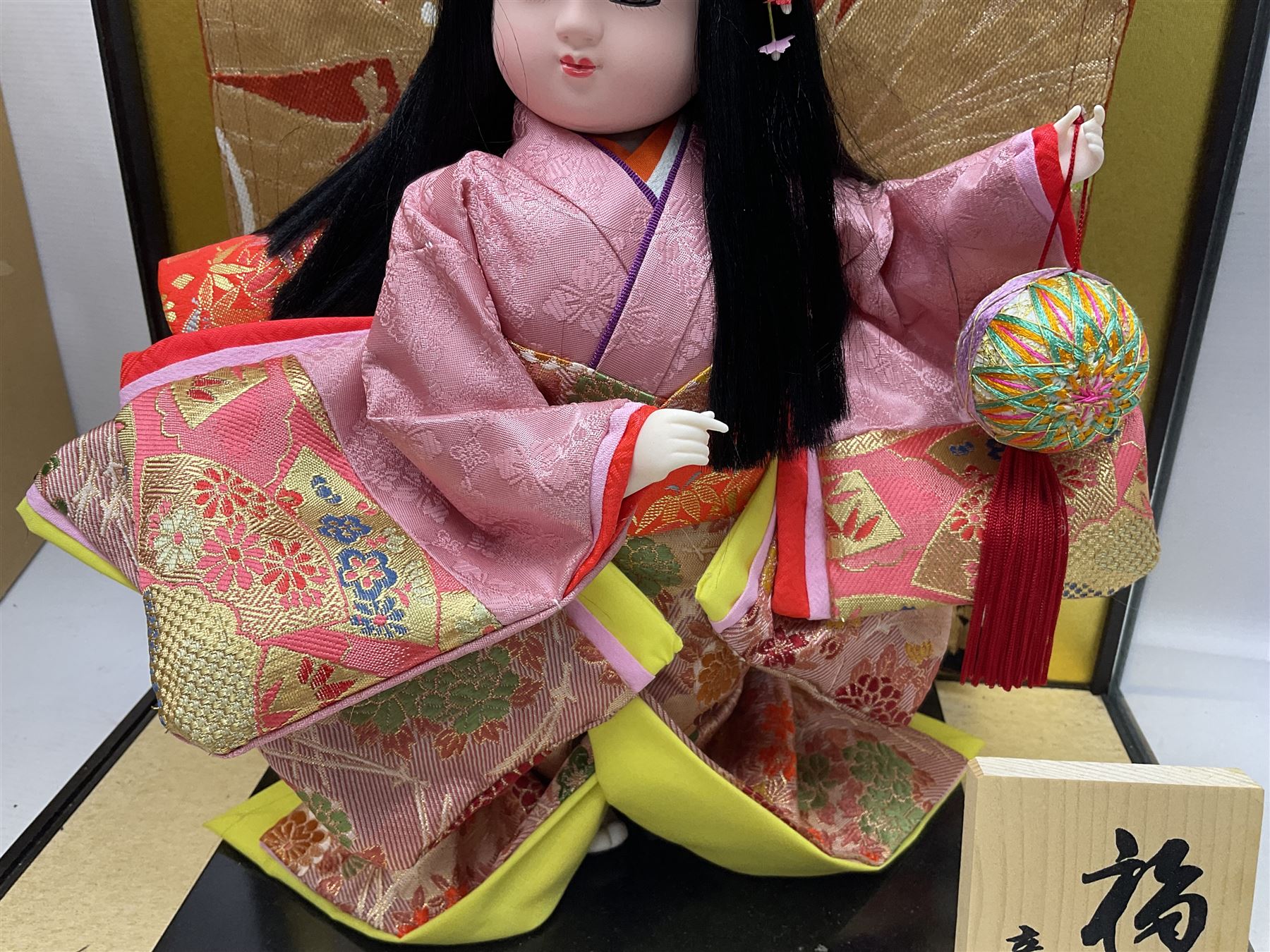 Japanese doll, dressed in traditional Japanese dress, within wooden glazed box, box H40cm