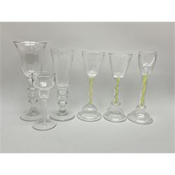 Six late 20th century Paul Manson Shilbottle Glass Studio drinking glasses, comprising three examples with multi series colour twist stems and pronounced domed and folded feet, an example with double series opaque twist stem, and two examples with multi knopped stems, each signed beneath. 