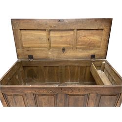Georgian oak mule chest, moulded rectangular hinged lid over quadruple fielded panel front, the frieze inscribed '17 A Y 57', fitted with two drawers, panelled ends and back, on stile supports