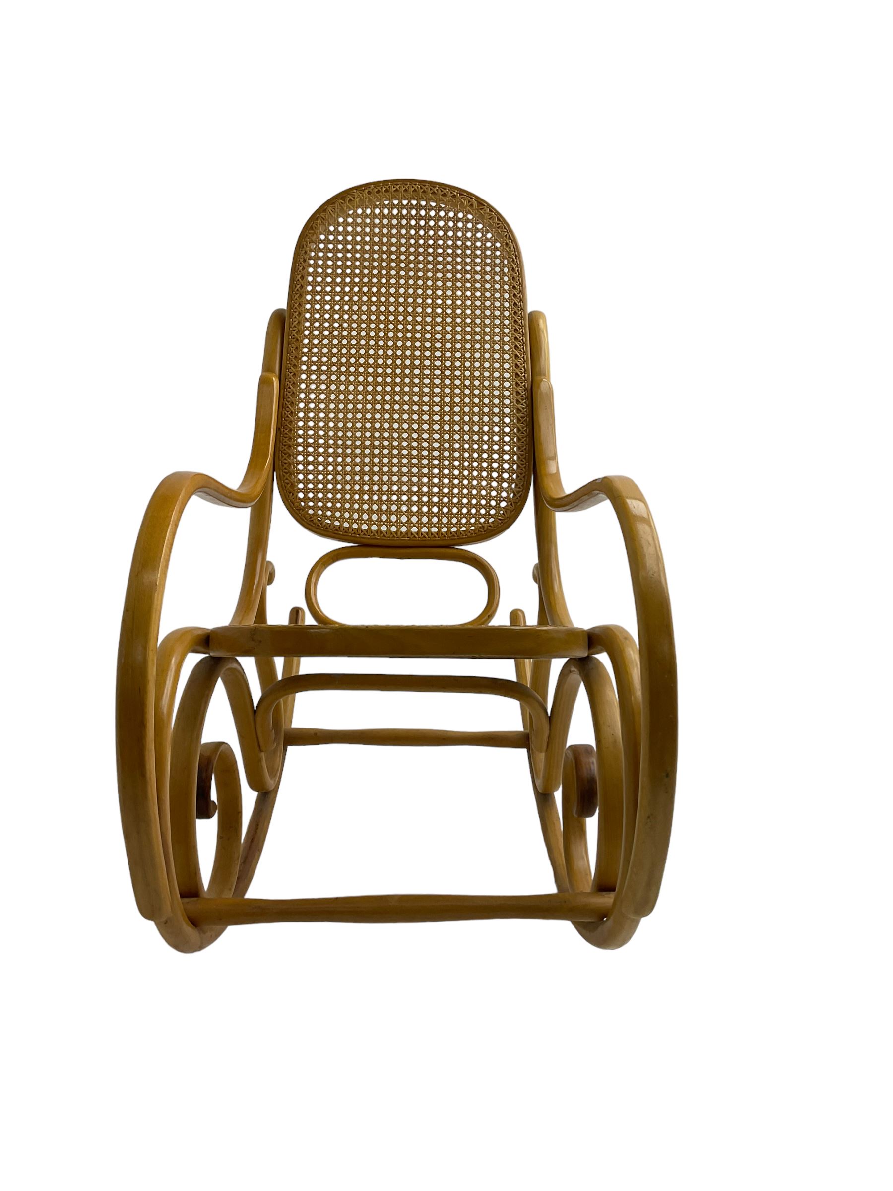 Early to mid-20th century Michael Thonet design bentwood rocking chair, with cane seat and back